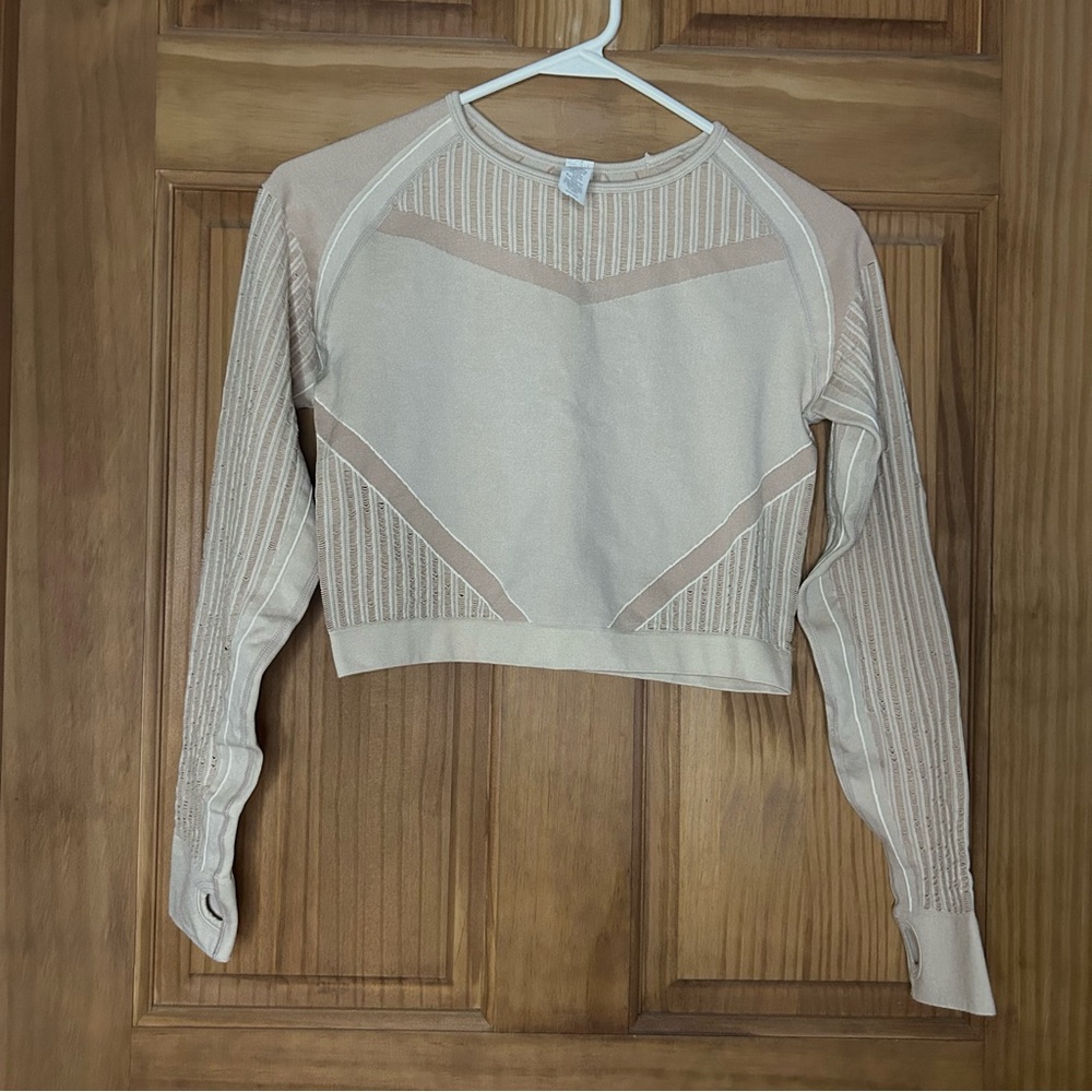 Women's cream long sleeve athletic top